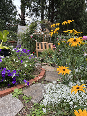 Outdoor garden path among colorful flowers
