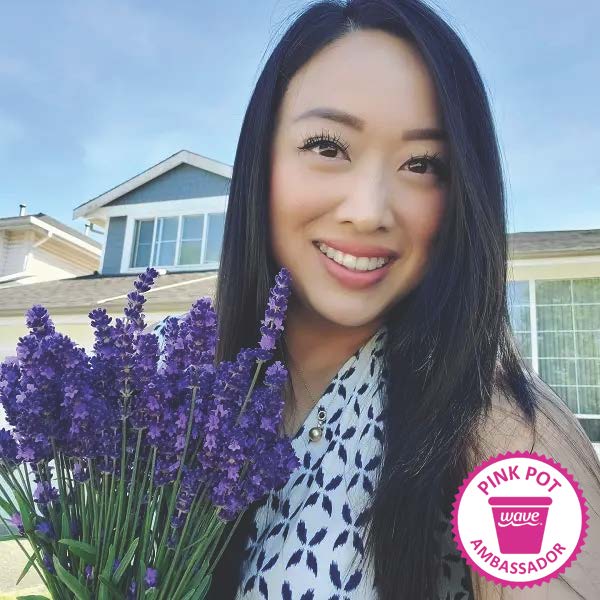 Wave Pink Pot Ambassador for July 2022 Judy outside holding purple flowers 