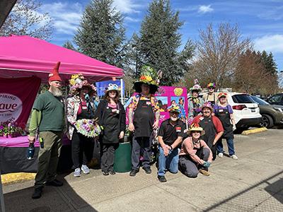 A group of people dressed in festive garden hats