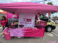 The Wave van parked behind a tent with pink decorations