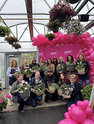 Group of gardeners at a planting party featuring Wave Petunias